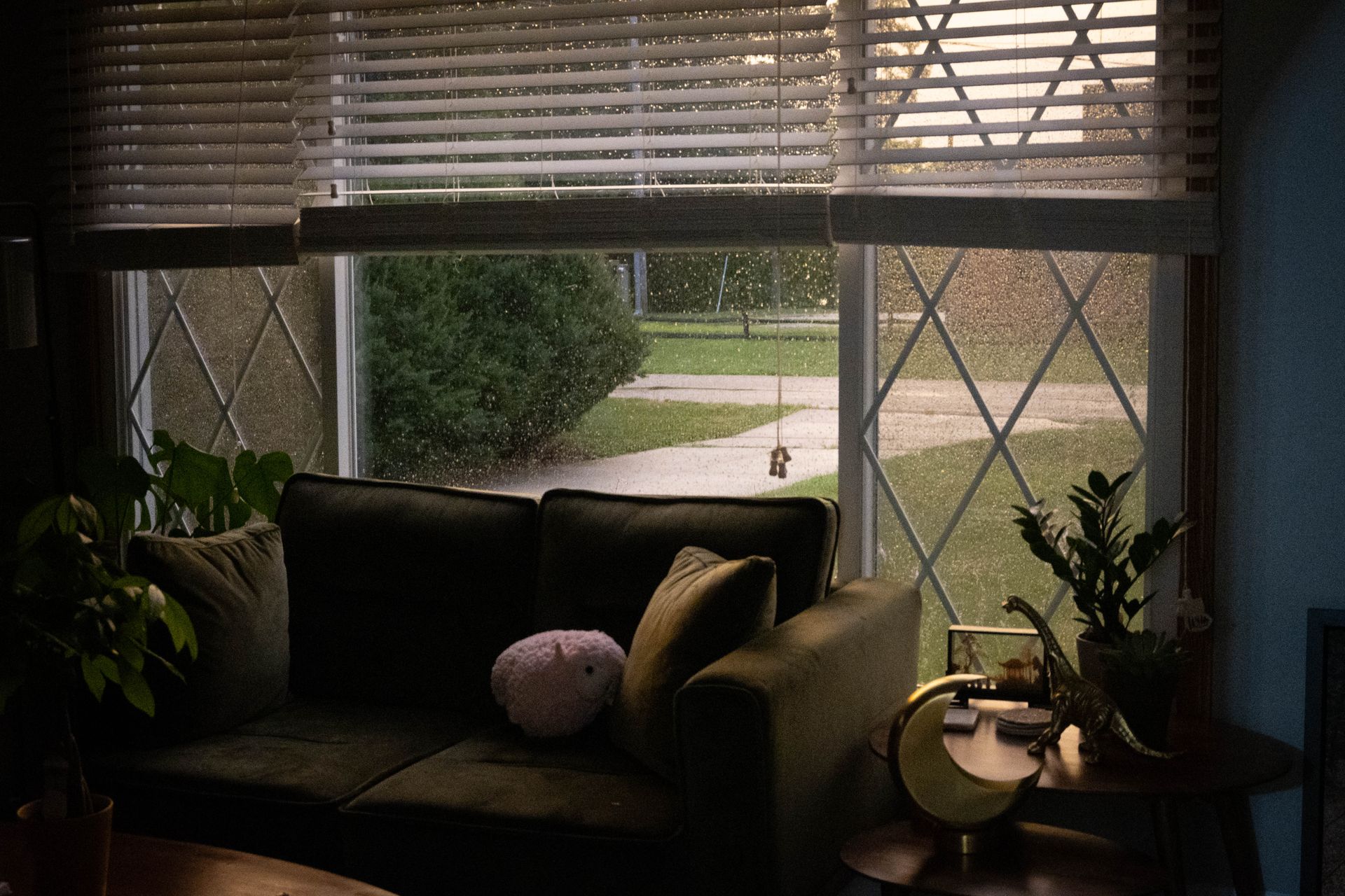cozy living room with rain-speckled windows
